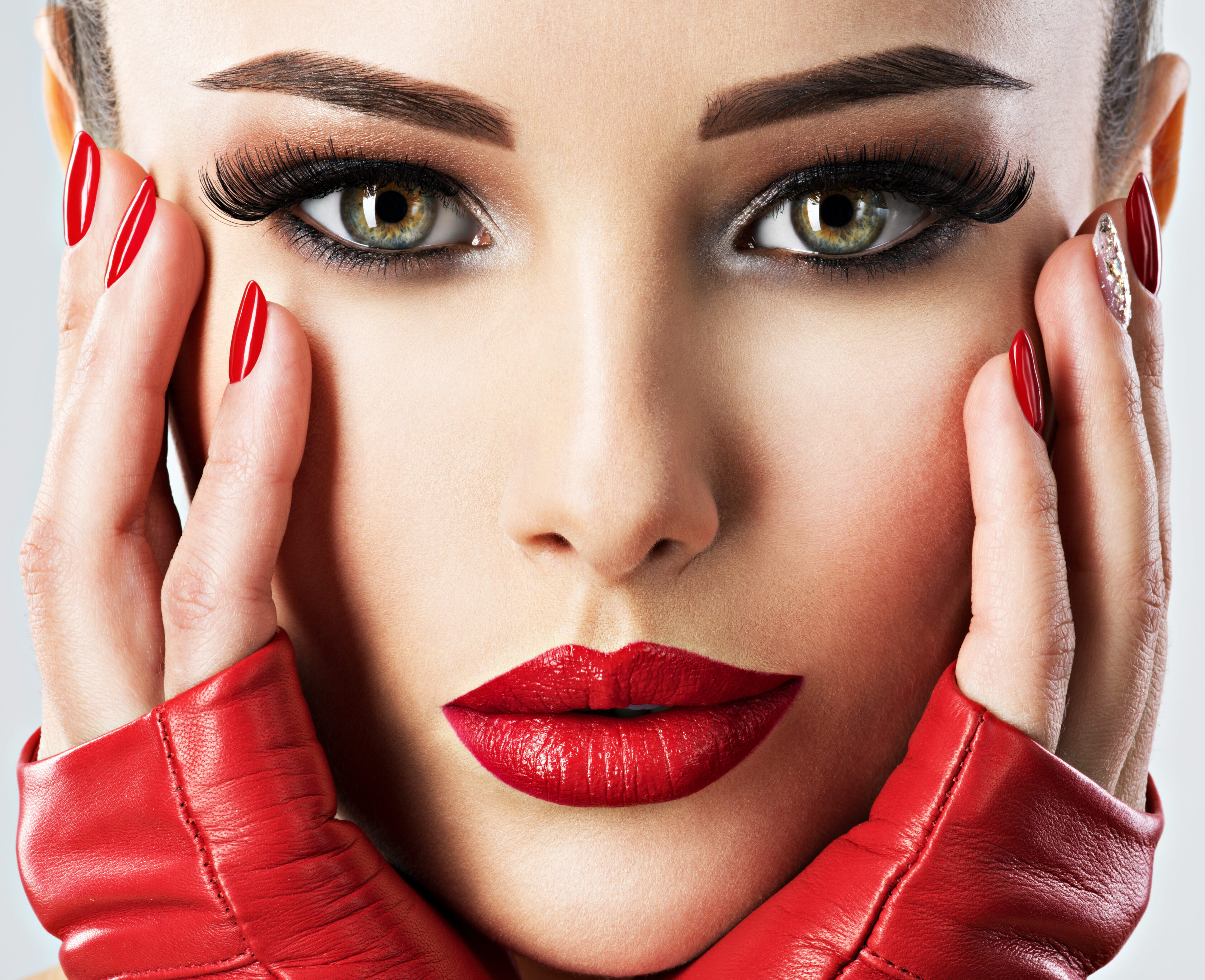 beautiful woman with bright fashion make-up and red lipstick on sexy lips. Closeup portrait.