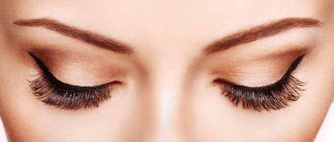 Female Eye with Extreme Long False Eyelashes. Eyelash Extensions. Makeup, Cosmetics, Beauty. Close up, Macro